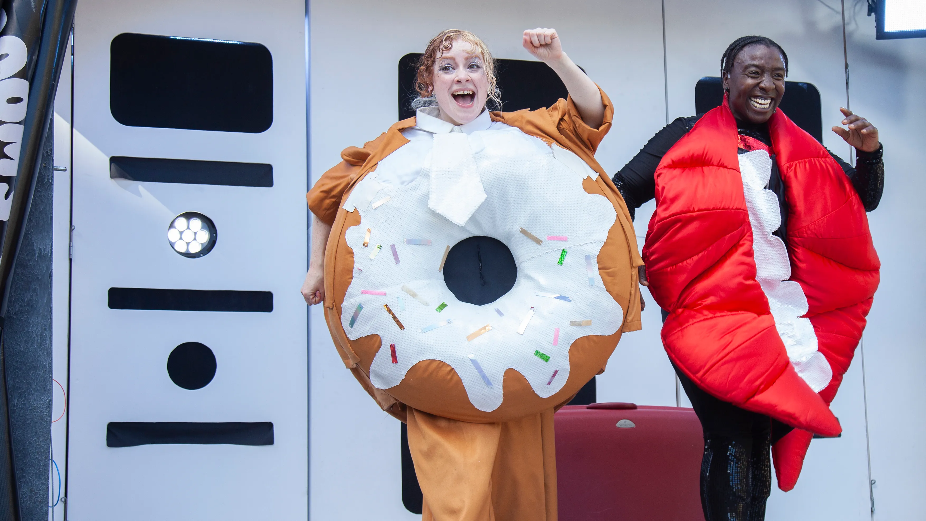 Doughnut and Mouth celebrating on stage