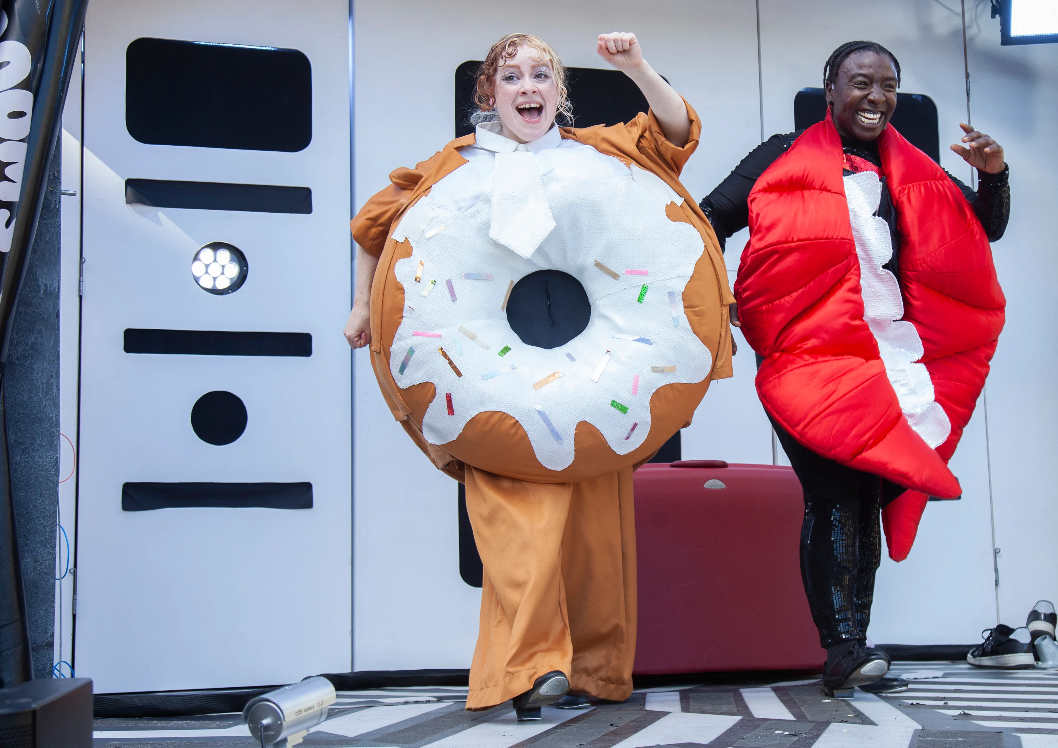 Doughnut and Mouth celebrating on stage